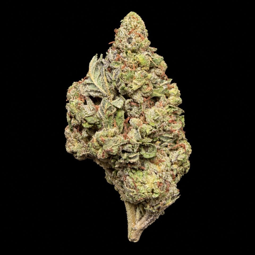 Layered cannabis flower bud with green and orange hues showing crystalline trichome coverage, isolated on black