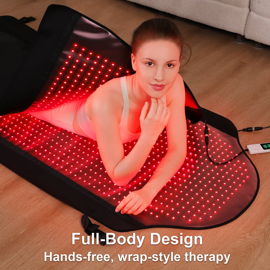 Person lying on red light therapy mat with full-body coverage during therapeutic session