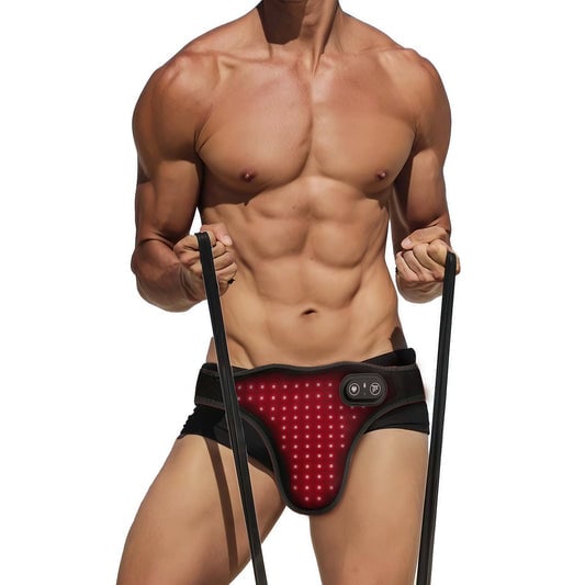 Man wearing red light therapy belt device with black straps for lower body treatment