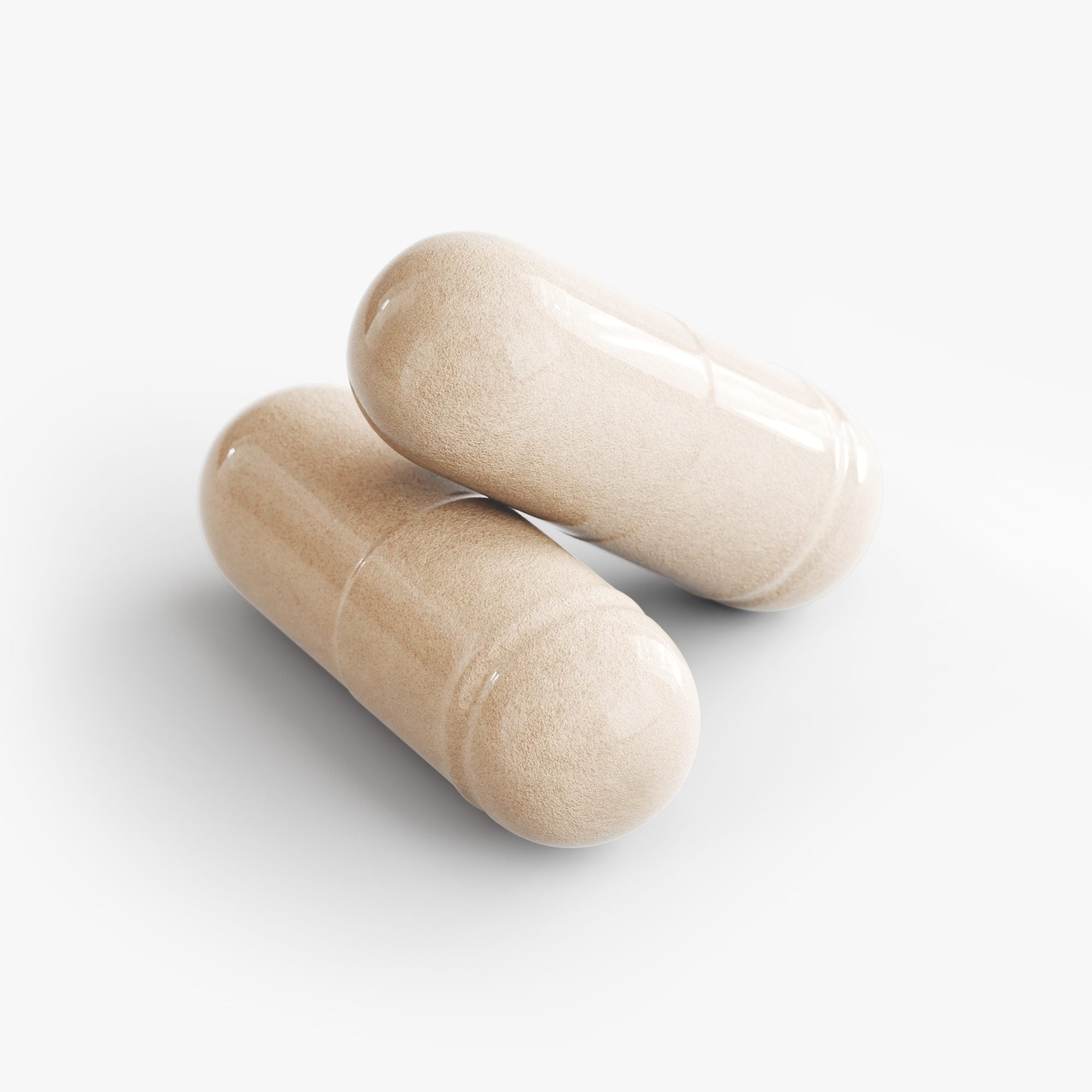 Close-up of two white cylindrical capsule pills on plain background