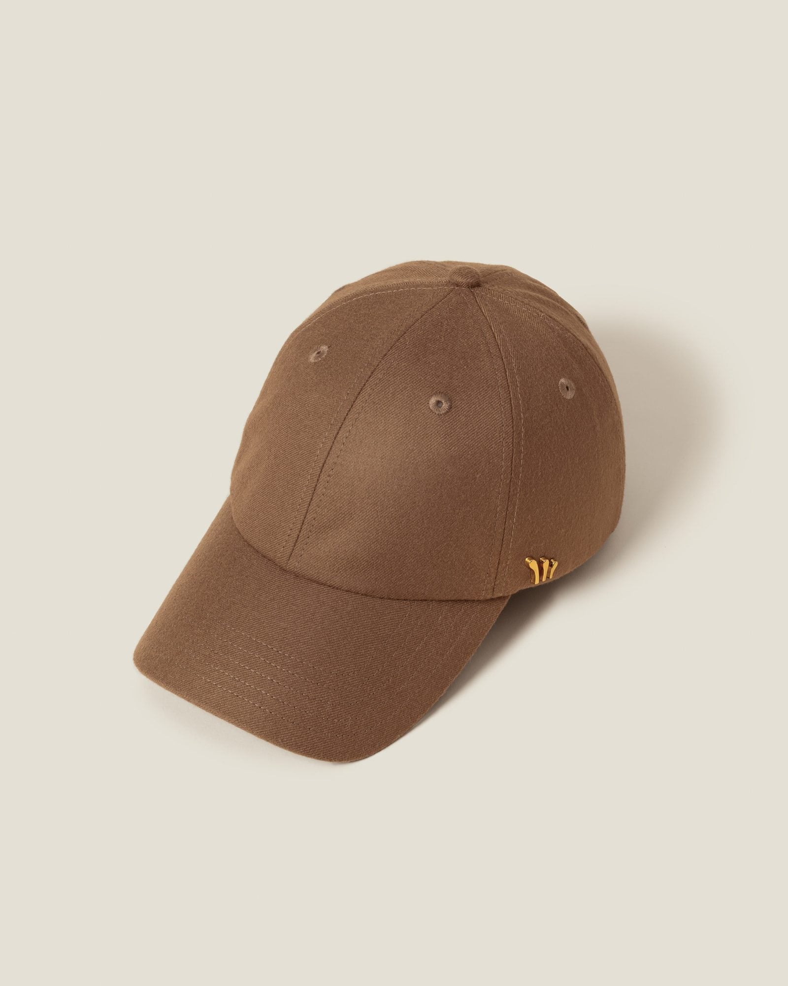 Tan baseball cap shown from angled front view